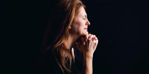 photo of mother in profile with black background