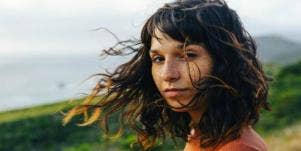 woman outside with windswept hair