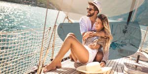 Man and woman on a boat laughing together