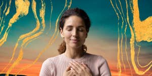 woman with hands on heart in front of a sunset & gold swirls