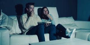 couple on couch watching TV
