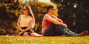 man and woman sitting opposite of each other