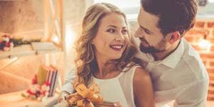 man giving woman gift