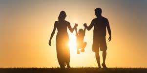 parents walking with toddler