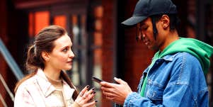 woman and man texting on phones