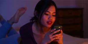 girl texting at night in bed