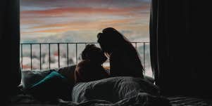 man and woman laying in bed