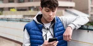 boy looking at iphone