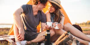 Couple camping outdoors