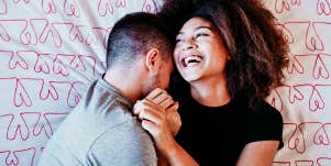 couple snuggling, wife laughing 