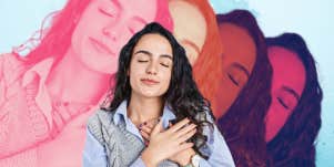woman with eyes closed hand over heart