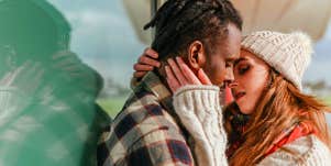 man and woman kissing