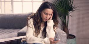woman looking at her phone