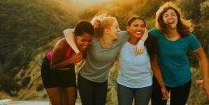 4 women laughing together