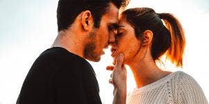 couple leaning in for a kiss