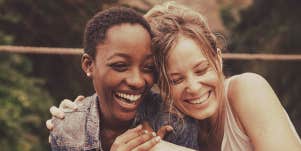 2 woman smiling