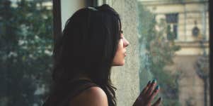 sad women looking out a window