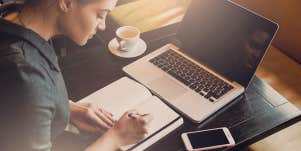 woman writing journal