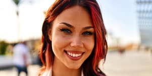 woman with red hair smiling 