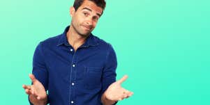 guy shrugging in front of mint green background