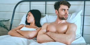 unhappy couple in bed