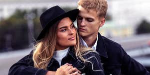 man hugging woman