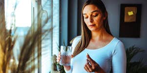 woman taking pill