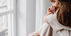 Woman sitting with her grief after a breakup