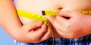 person measuring stomach