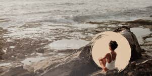Woman sitting on rocks taking time for herself