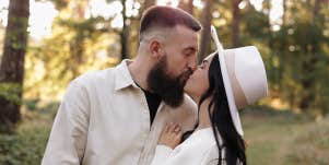 man and woman kissing