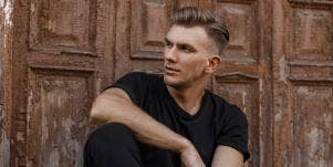 man sitting looking to the side