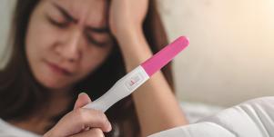 woman with a negative pregnancy test