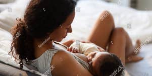 woman breastfeeding baby
