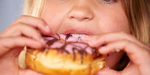 girl eating donut