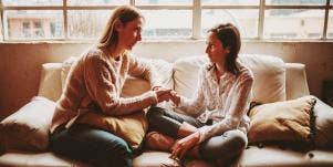 mom and daughter sitting on couch