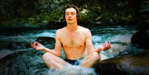 man breathing and meditating