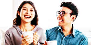 Man looking at woman, who is laughing