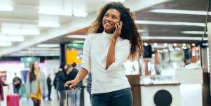 Woman on the phone in an airport
