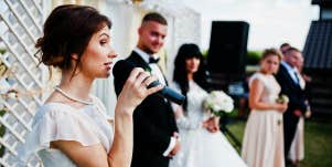 woman giving speech at a wedding