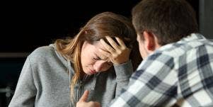 woman crying in front of man