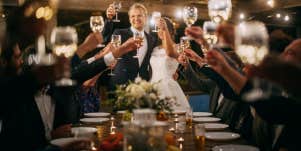 bride and groom doing wedding toast at reception