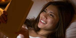 woman looking at tablet