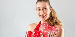 woman opening valentine's day gift