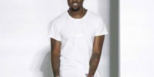Kanye West at fashion week in white shirt 