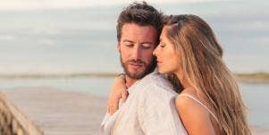woman cuddling man