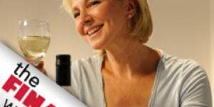 woman holding glass of wine