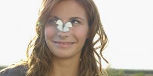 girl with butterfly on nose