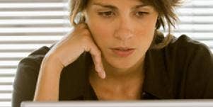 woman looking at computer