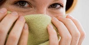 girl hiding behind fabric